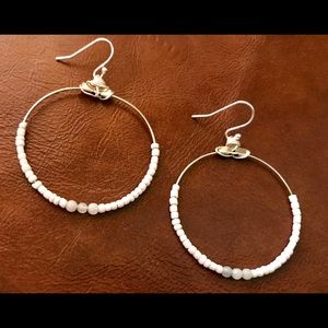 Cool, chic white and pink beaded earrings.